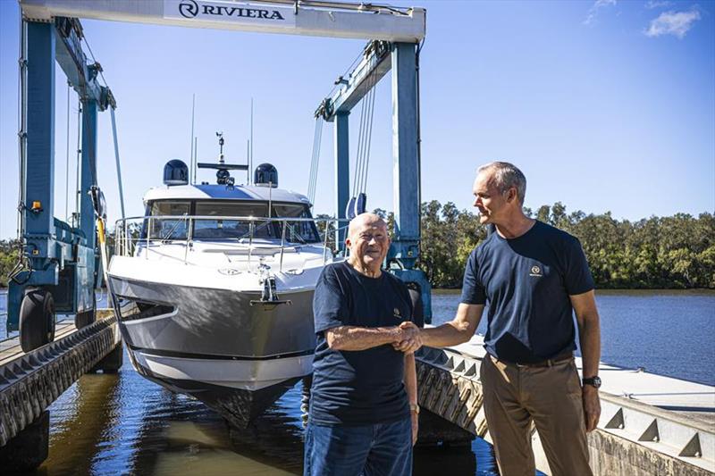 Riviera owner Rodney Longhurst (right) congratulates Peter Haig on the delivery of his 5400 Sport Yacht Platinum Edition, the 6,000th Riviera yacht launched photo copyright Riviera Australia taken at  and featuring the Power boat class